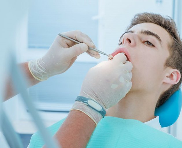 a teen patient undergoing the tooth extraction process