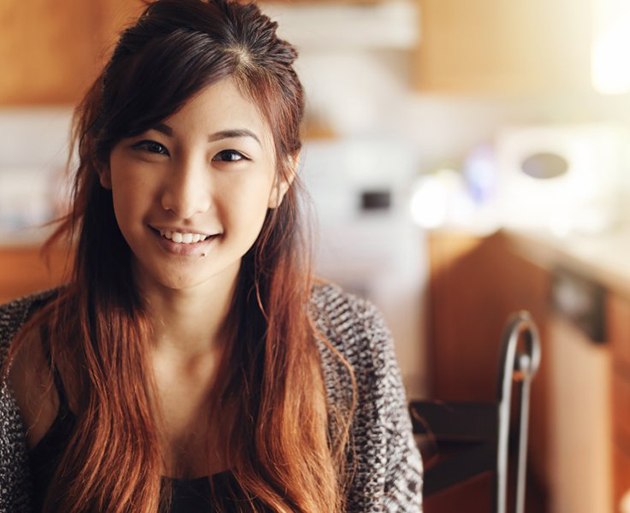 a teen girl smiling after undergoing dental treatment