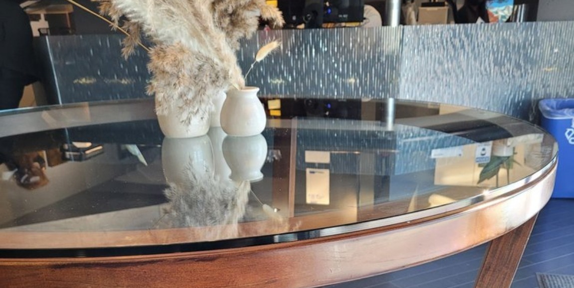 White ceramic jars on glass tabletop