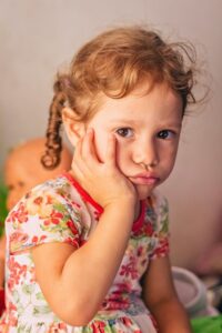 Little girl with dental pain